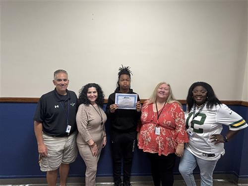 Lamario Cooley, Wilson's Stairclimber for October, poses with his award plaque.